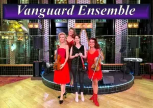 Vanguard Ensemble professional electric string trio performing live on stage for a corporate event in Sydney.